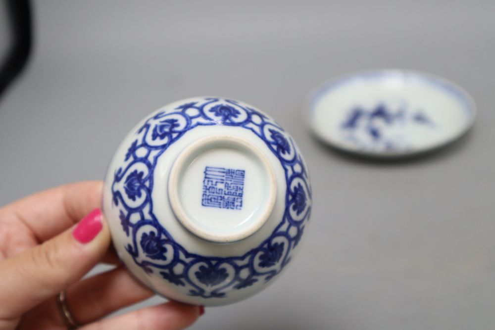 Two Chinese blue and white cups and a saucer, one with reign mark